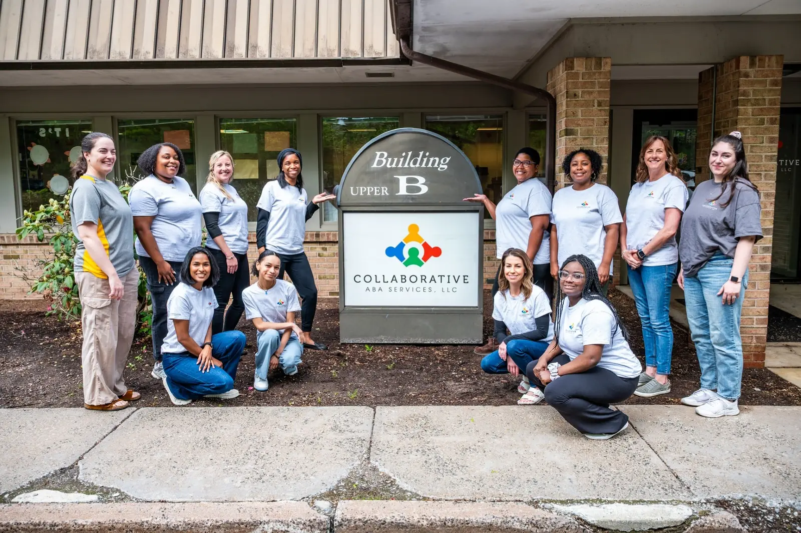 Collaborative ABA Services team group photo outside Building B