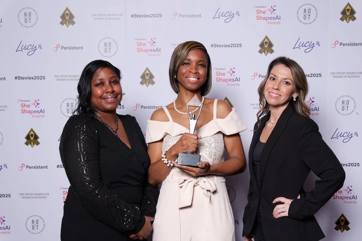 Alisha Simpson-Watt and team holding the 2025 Stevie Award at The Stevie Awards for Women in Business / She Shapes AI Awards ceremony